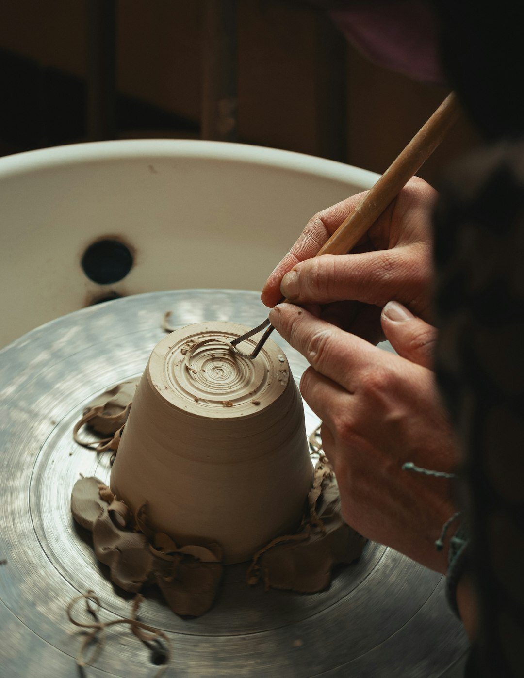 artisan potter working with clay
