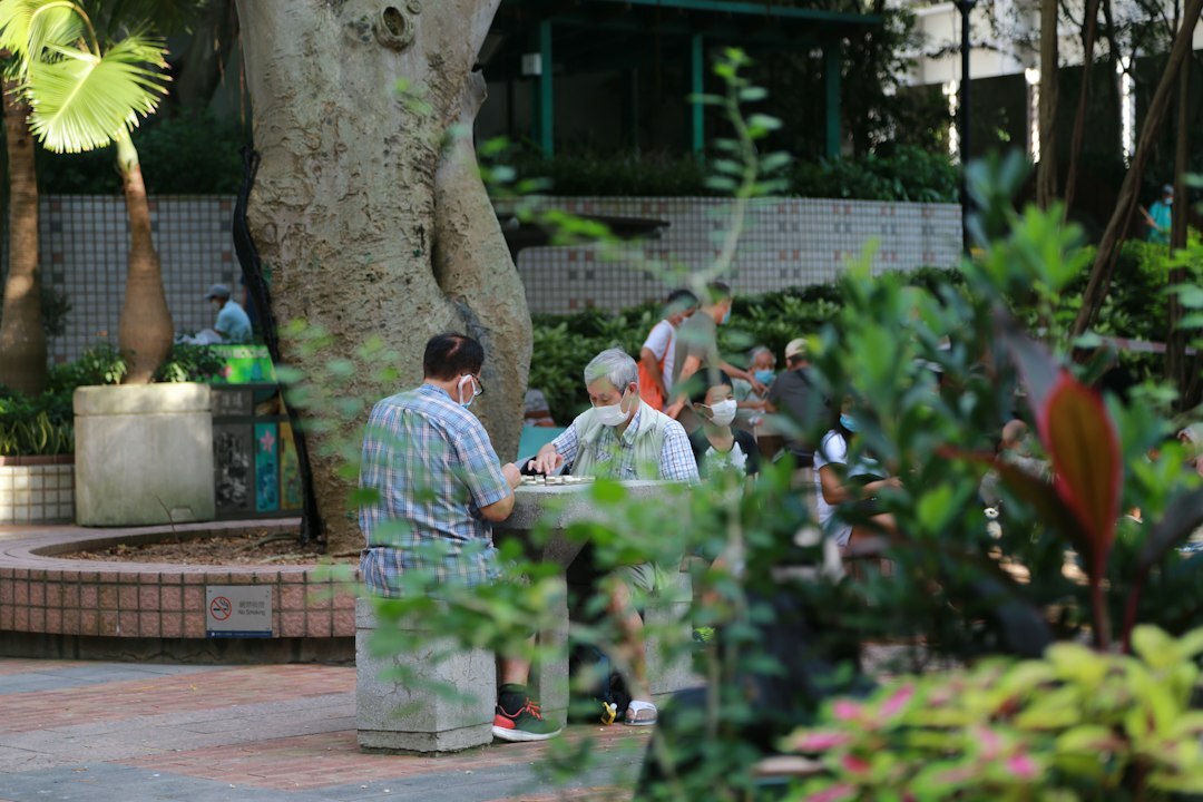 elderly people talking in park